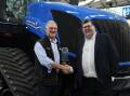 On-Trac Ag director Peter Russell receiving the New Holland Dealer of the Year award for three or more branches from CNH CBU3 operations manager Bruce Healy. Picture supplied