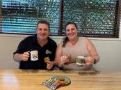 Mount Isa CWA member Amanda Turner shared a batch of Anzac Biscuits with Mount Isa RSL president Troy Hartas, a 20 year veteran who was in the Royal Australian Navy. Picture: Supplied