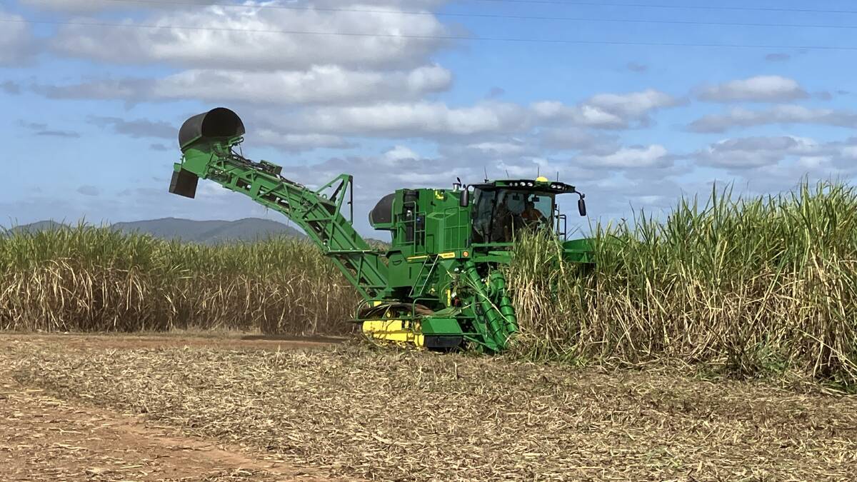 One of the two newly sold John Deere CH960 two row cane harvesters in action around Proserpine. Picture supplied by RDO Machinery Mackay