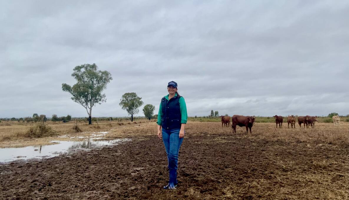 Tamara Finger, TF2 Grazing Company, Middlemount, with some heifers after 115 mm of rain. Picture: supplied