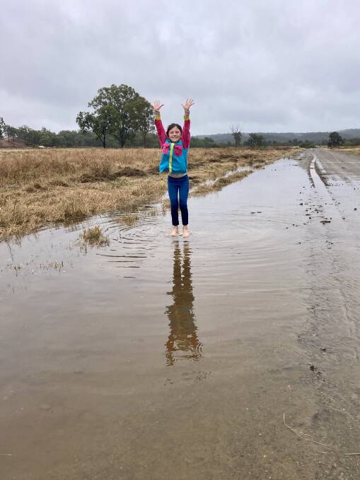 Seven-year-old Chelsea Hinz, Forest Home, Marlborough, was jumping for joy at all the rain. Picture: Judith Maizey