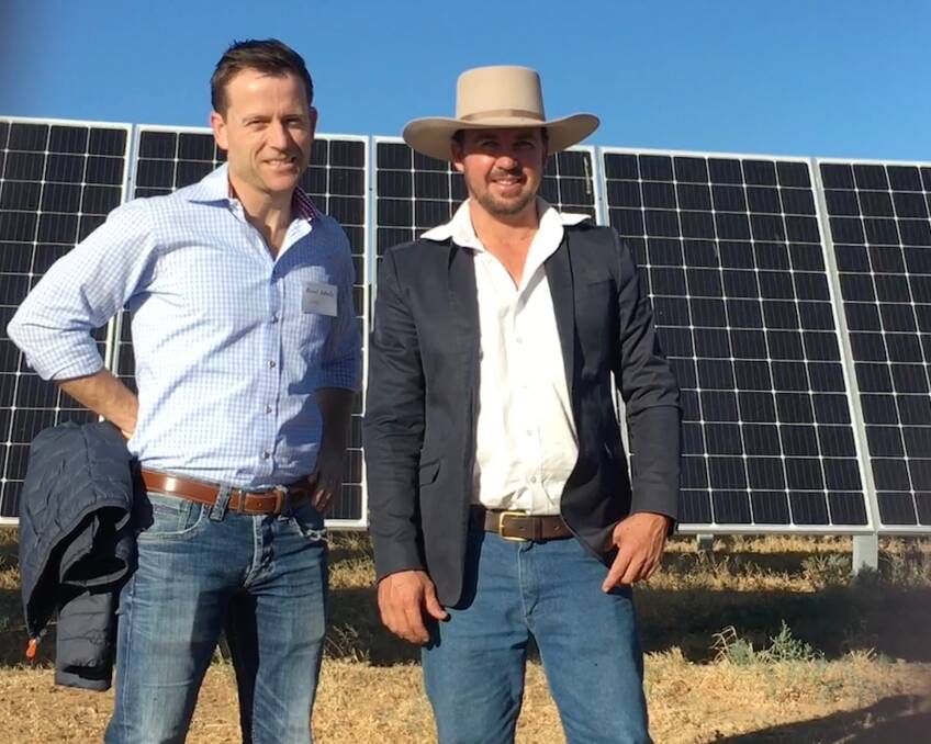 NAB's Errol Shultz and James Walker of Camden Park Station, Longreach, at the solar farm on Mr Walker's property. Pic supplied