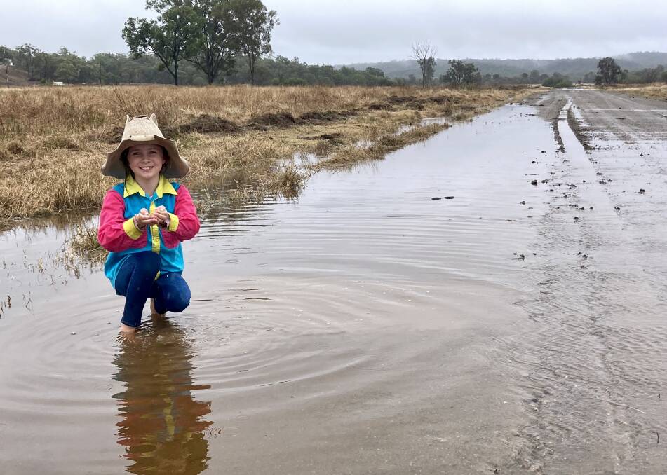 Seven-year-old Chelsea Hinz, Forest Home, Marlborough, was happy to see the rain. Picture: Matthew Hinz