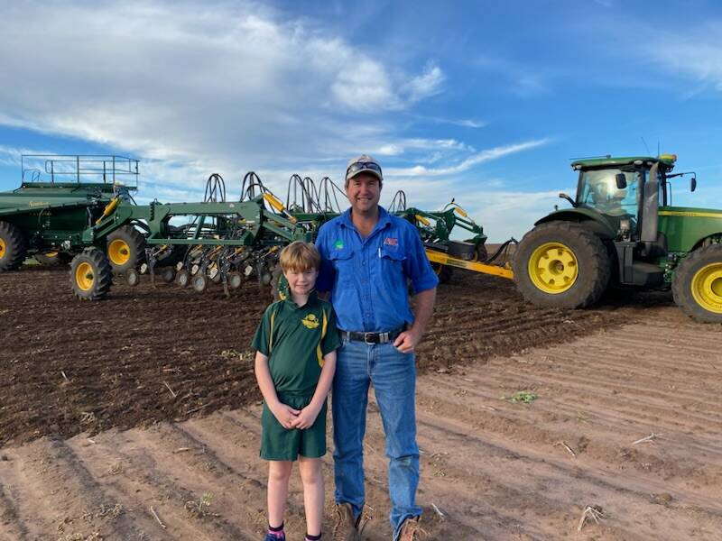Andrew Butler with his son, Matthew, on their Condamine property, North Beaufort, where they have planted wheat and chickpeas. Picture: Supplied. 