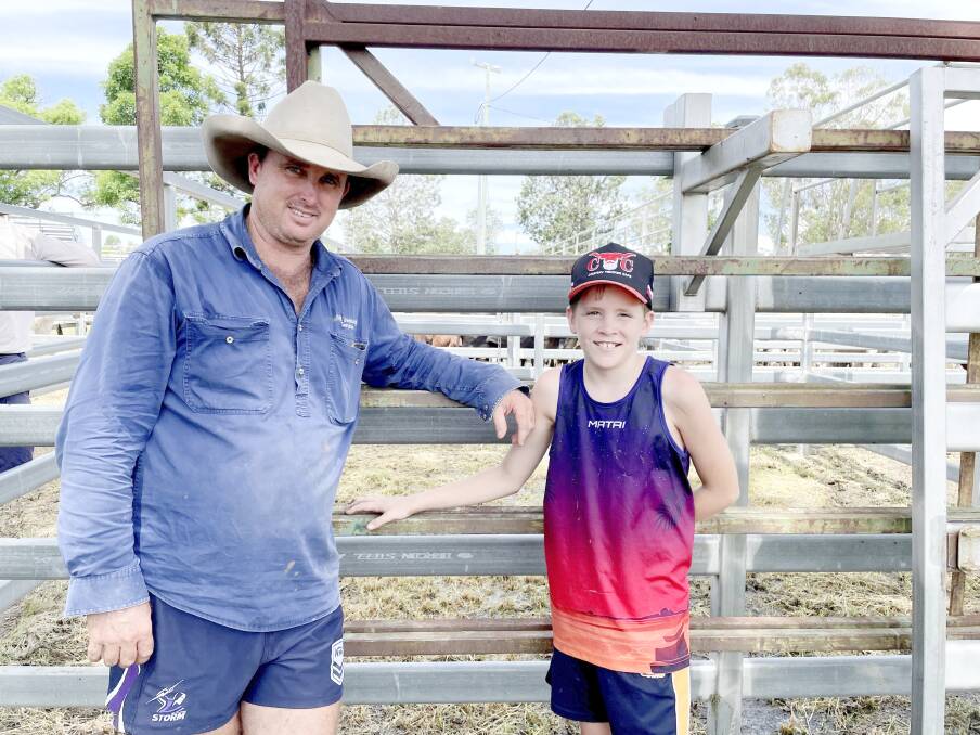 NR Livestock's Nick Riley with Dallas Hynd, 12, at the Scenic Rim store sale at Beaudesert on Friday, where they sold 60 Euro cross heifers. Picture: Alsion Paterson 