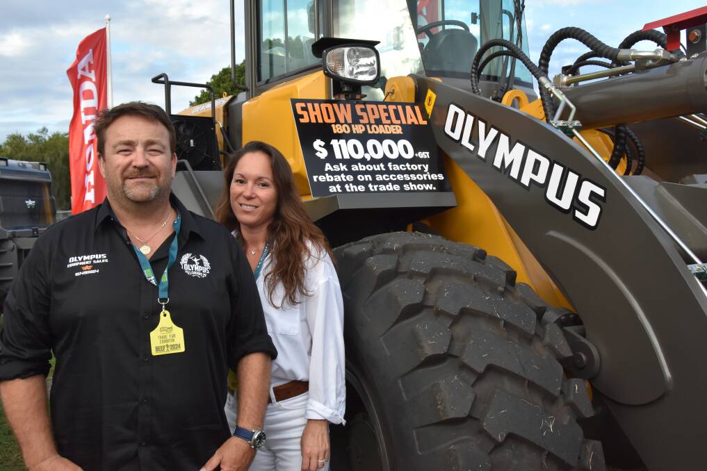 Simon Collins and Ellie Benson from Olympus Loaders with a front loader. Picture: Steph Allen