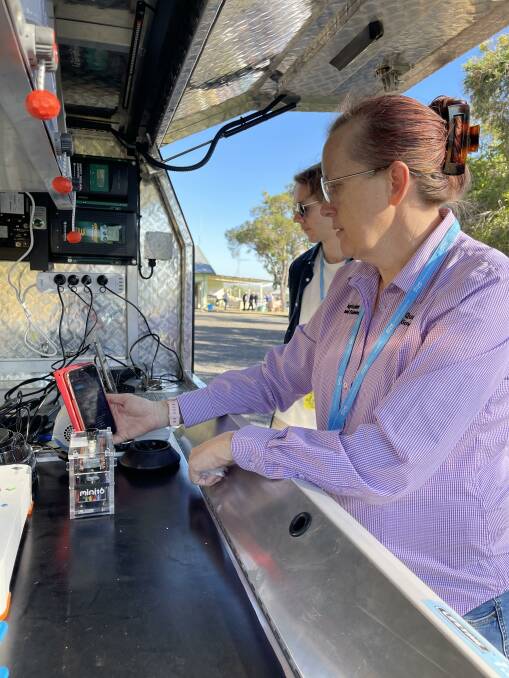DAF scientist Dr Beth Fowler showing the testing machine to attendees at the Brian Pastures Field Day. Picture: Supplied 