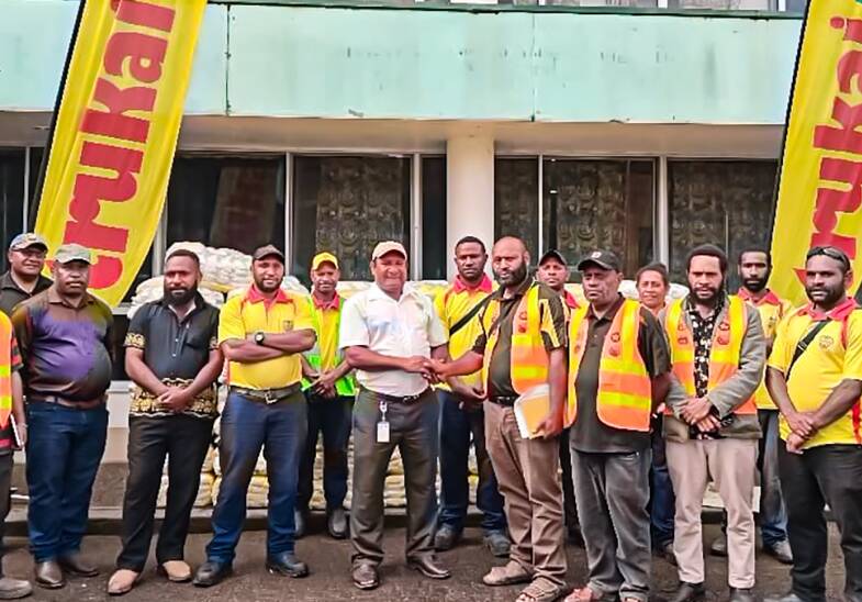 Mulitaka district village leaders and Trukai Industries representatives with members of the PNG natural disaster committee. Photo SunRice.