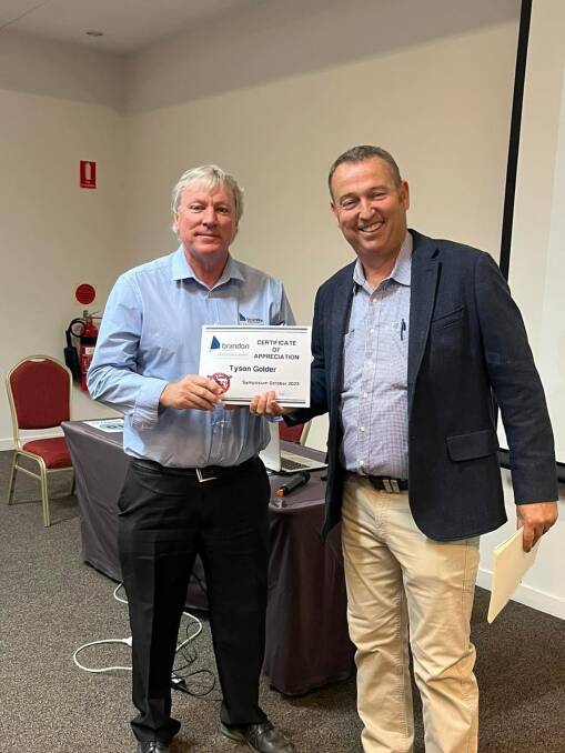 Bryan presenting then-Maranoa Regional Council mayor Tyson Golder with a certificate of appreciation for the council's support of the annual Brandon & Associates symposium. Picture: Supplied