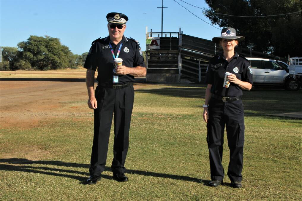 Queensland Police assistant commissioner Mike Condon and Longreach patrol group inspector Julia Cook paying an early morning visit to the Blackall cattle sale.