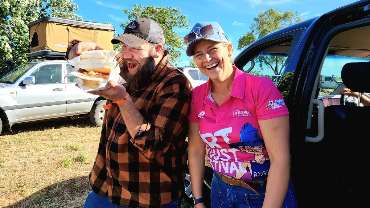 Dirt n Dust Festival president Sheree Pratt serves up bacon and egg sangas to one of the weekend's happy campers. Picture: Sally Gall