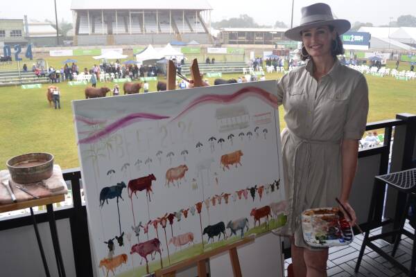 Australian artist Laura Crane, Toowoomba, captured the interbreed competition in a painting at Beef Australia in Rockhampton. Picture by Bryce Eishold