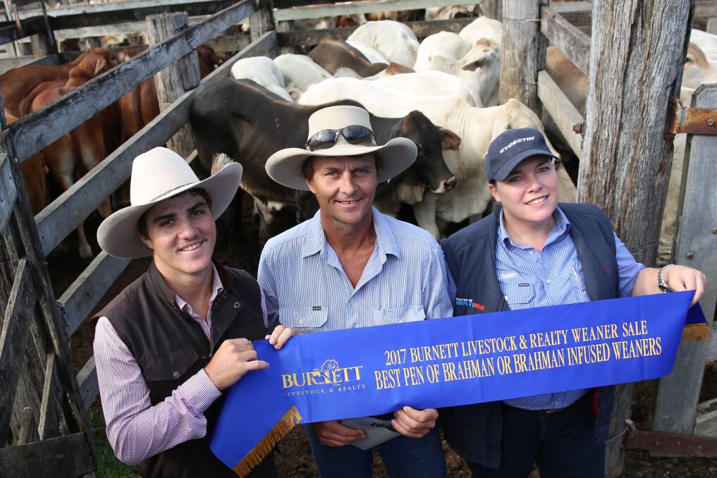 BIGGENDEN WINNERS: Winner of the Brahman class Brayden and Ashley Trigger, Biggenden, with Prudence Barwick, Virbac Animal Health. The steers sold for 346.2c or $986/head.