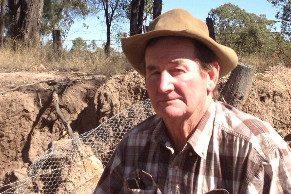 Cameby Concerned Citizens Group chair Dave McCabe says QGC will now trench Columboola Creek rather than go under the watercourse as agreed. Mr McCabe is pictured at nearby Weir Road with what he says is erosion typical of disturbed soil in the area. <i>Picture: MELODY LABINSKY.</i>