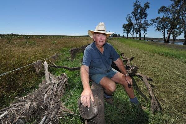 Landholder Hilary O'Leary inspects the damage on his property south of Toowoomba after the January floods.