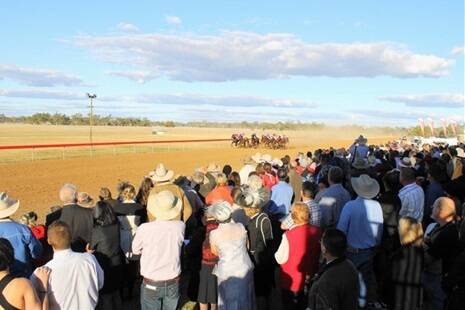 A packed grandstand watched the running of the Tambo Cup, won by the Blackall trained horse Joe Blow.