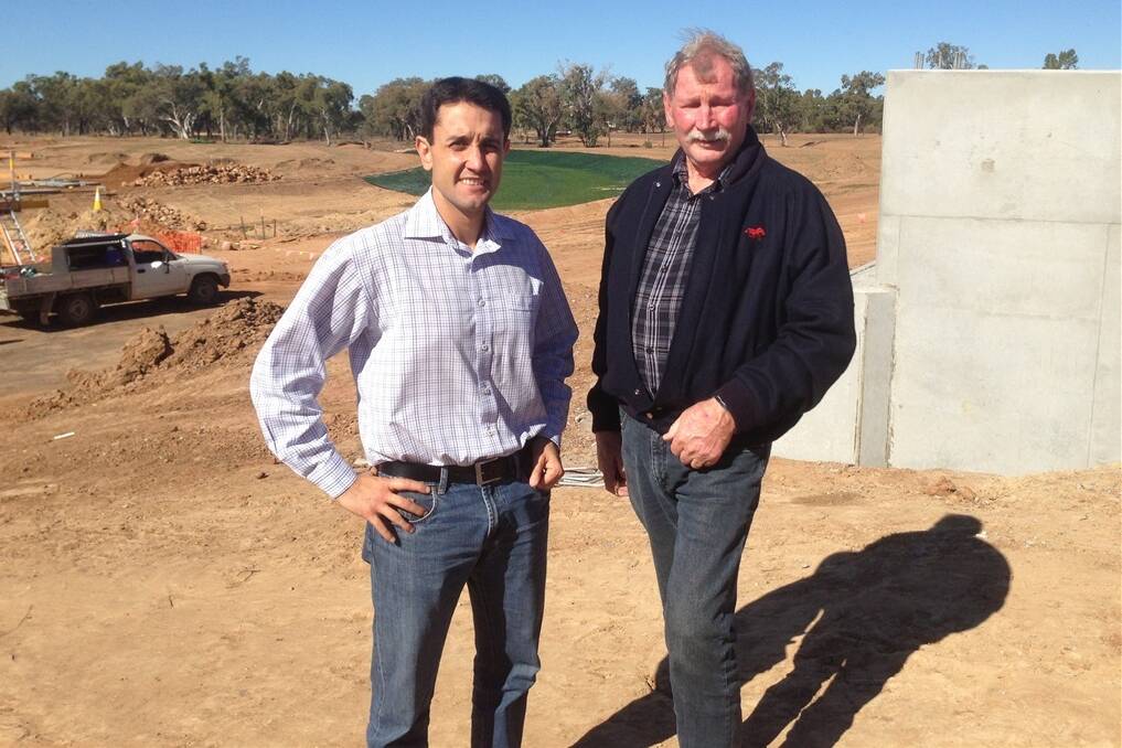 Local Government, Community Recovery and Resilience Minister David Crisafulli with Murweh Shire Council Mayor Denis Cook at the Bradley’s Gully flood diversion channel in Charleville.
