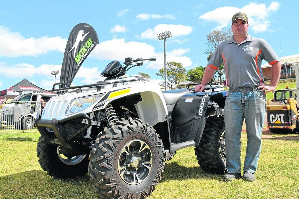 Arctic Cat dealer-manager for Queensland and the Northern Territory, Shane Ladynski, with an Arctic Cat 1000XT ATV.