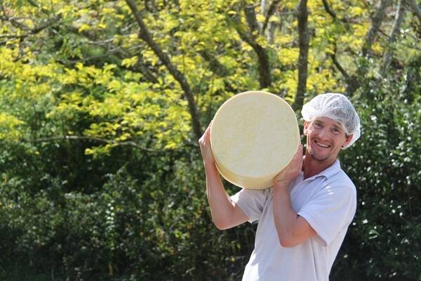 Sporting a cheesy grin is New Zealand-born artisan cheesemaker Adam Papprill.