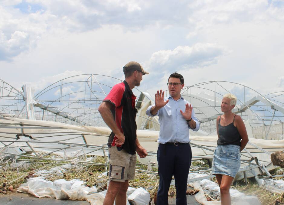 Scott Steffan with Federal Leader of The Nationals and Shadow Minister for Agriculture David Llittleproud and his wife Heidi inspecting the damage to the overhead irrigation on their farm at Crowley Vale. Picture Helen Walker